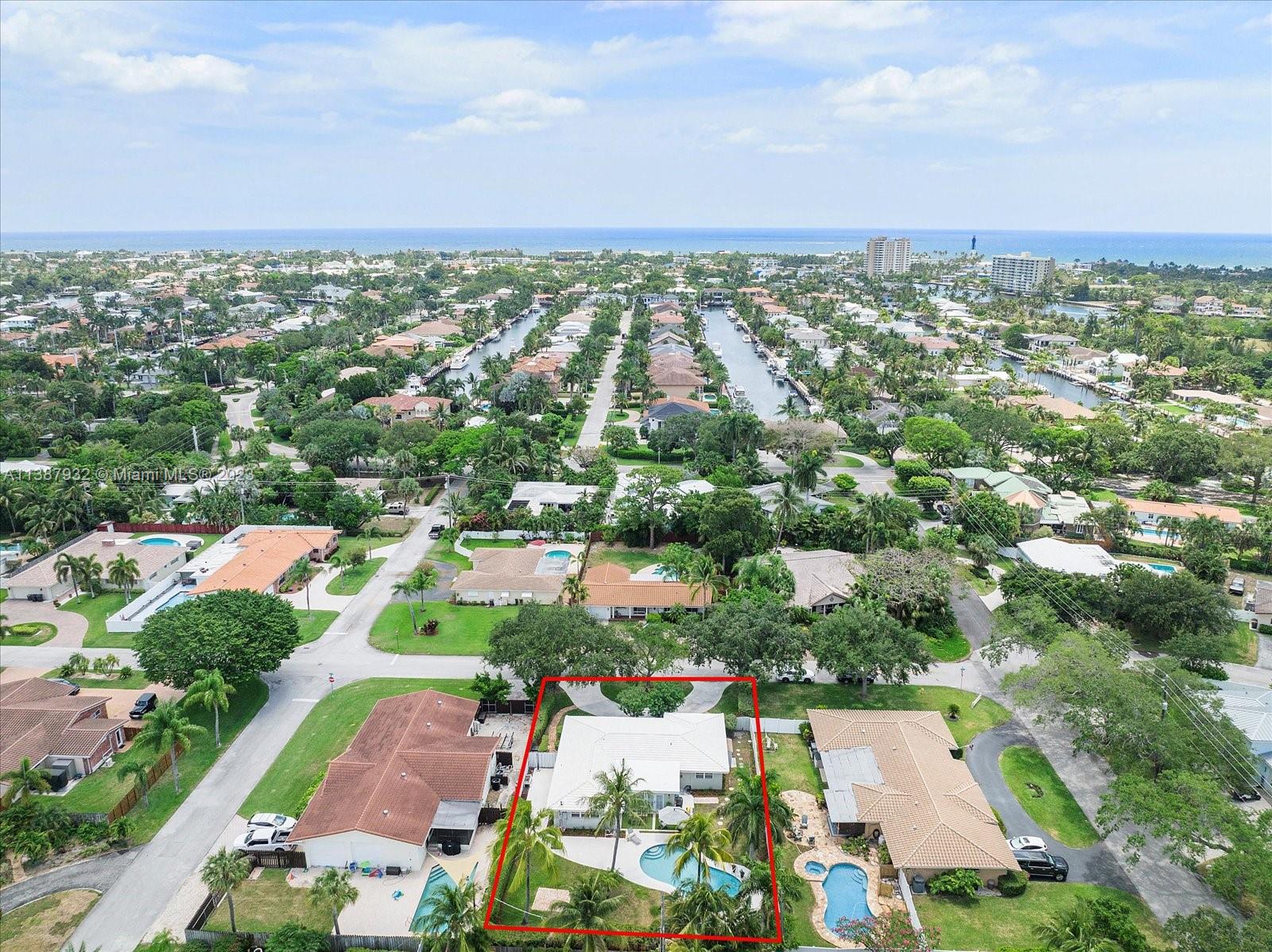 2533 Northeast 21st Terrace Lighthouse Point, FL 33064 - Photo 44 of 45 an aerial view of residential houses with outdoor space and trees
