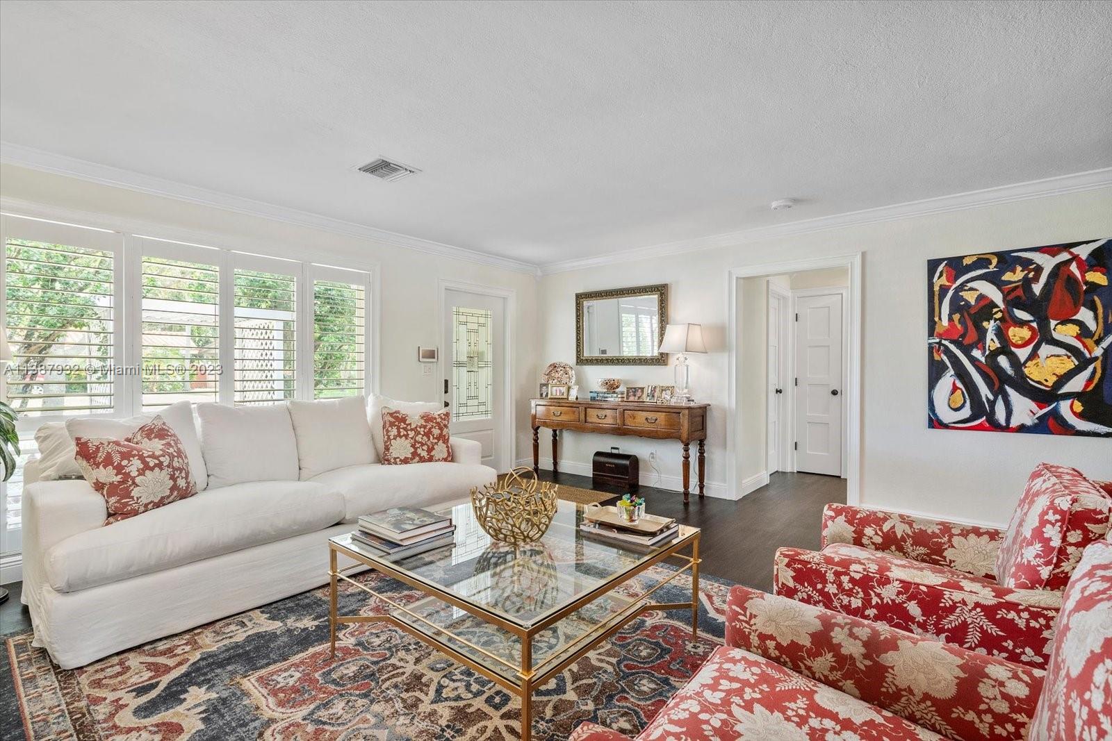 2533 Northeast 21st Terrace Lighthouse Point, FL 33064 - Photo 6 of 45 a living room with furniture and a fireplace