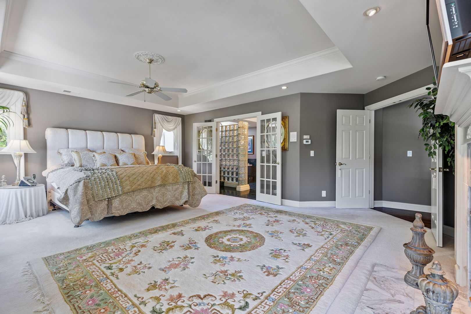 25565 South Tehle Road Elwood, IL 60421 - Photo 27 of 68 a spacious bedroom with a bed a couch and large windows