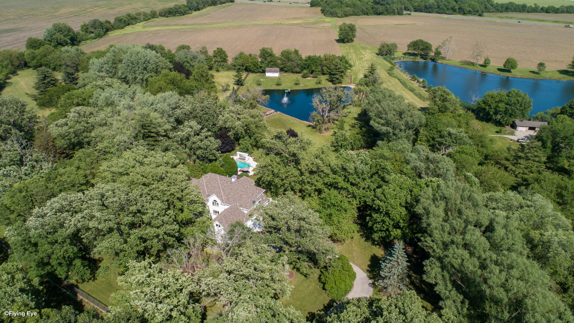 25565 South Tehle Road Elwood, IL 60421 - Photo 4 of 68 an aerial view of a house with a yard and lake view