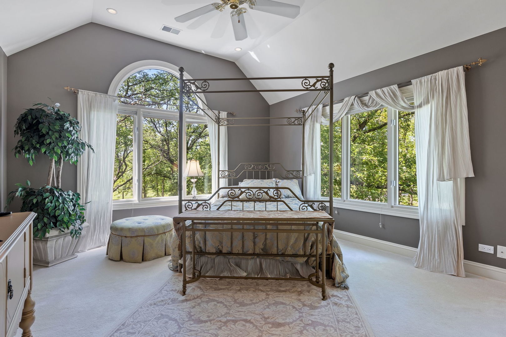 25565 South Tehle Road Elwood, IL 60421 - Photo 34 of 68 a spacious bedroom with a bed and a chandelier