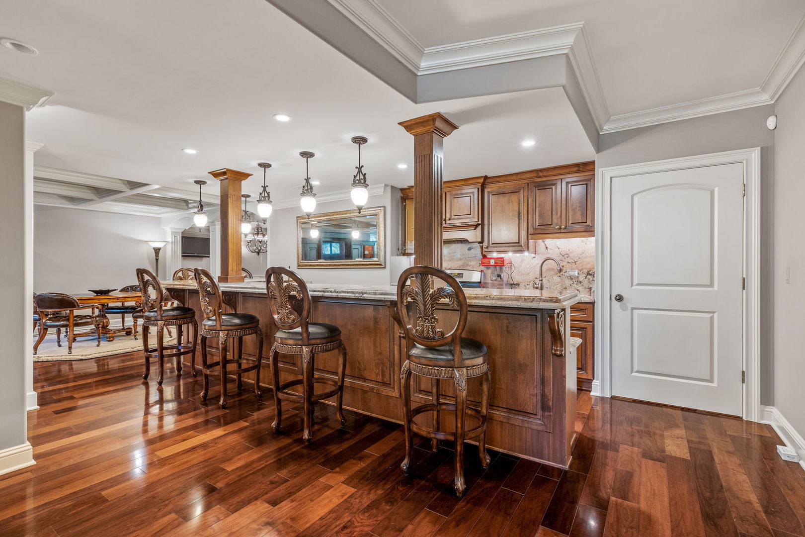 25565 South Tehle Road Elwood, IL 60421 - Photo 40 of 68 a room with lots of wooden furniture and a wooden floor