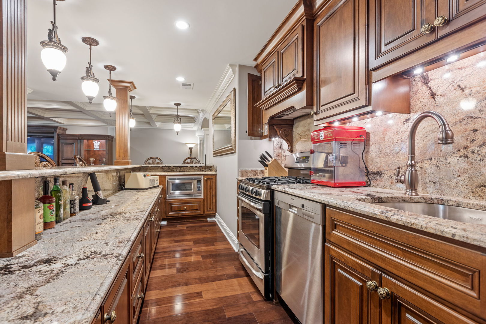 25565 South Tehle Road Elwood, IL 60421 - Photo 41 of 68 a kitchen with kitchen island granite countertop lots of stainless steel appliances a sink and cabinets