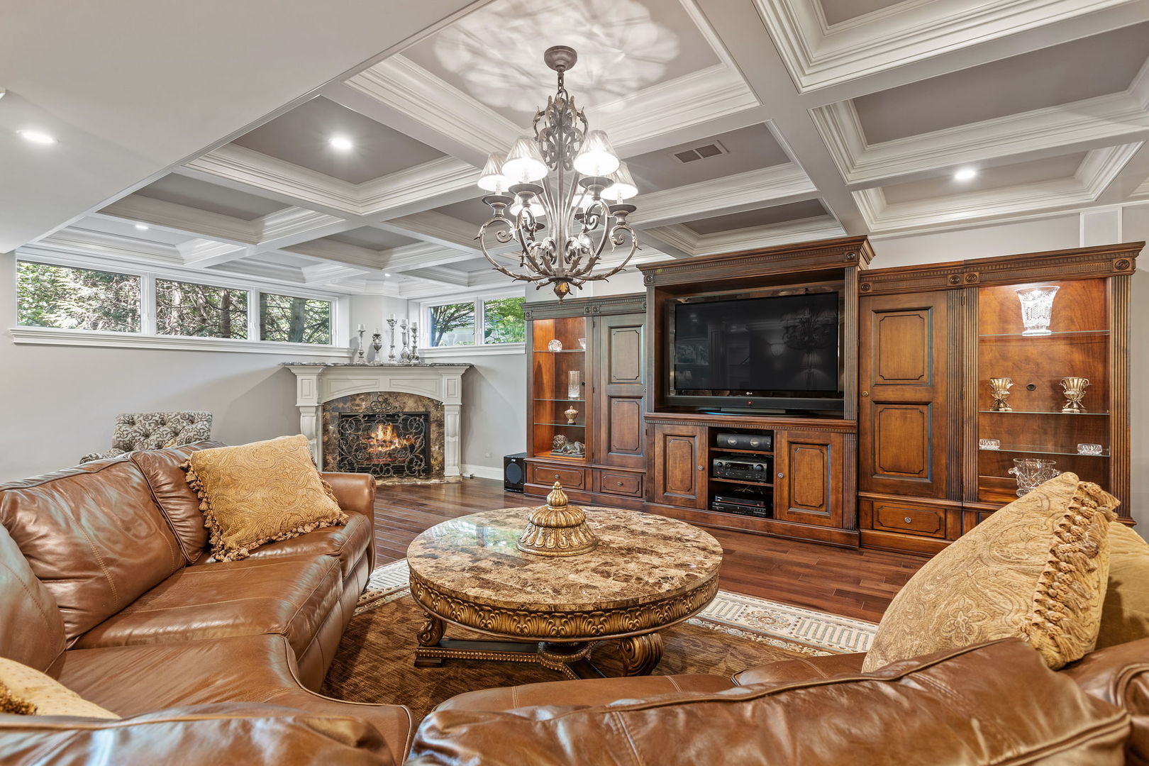 25565 South Tehle Road Elwood, IL 60421 - Photo 42 of 68 a living room with furniture a flat screen tv and a fireplace
