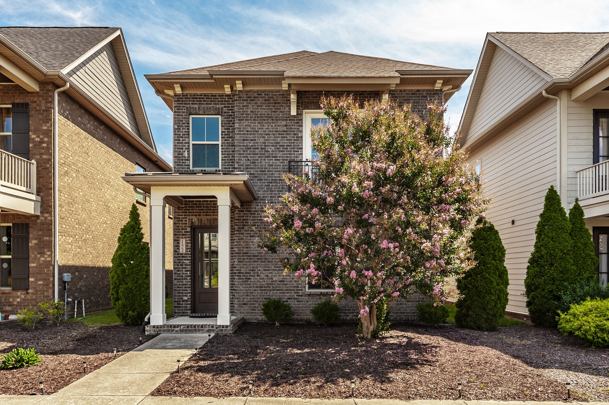 152 Ashcrest Point Hendersonville, TN 37075 - Photo 1 of 63 a front view of a house with garden