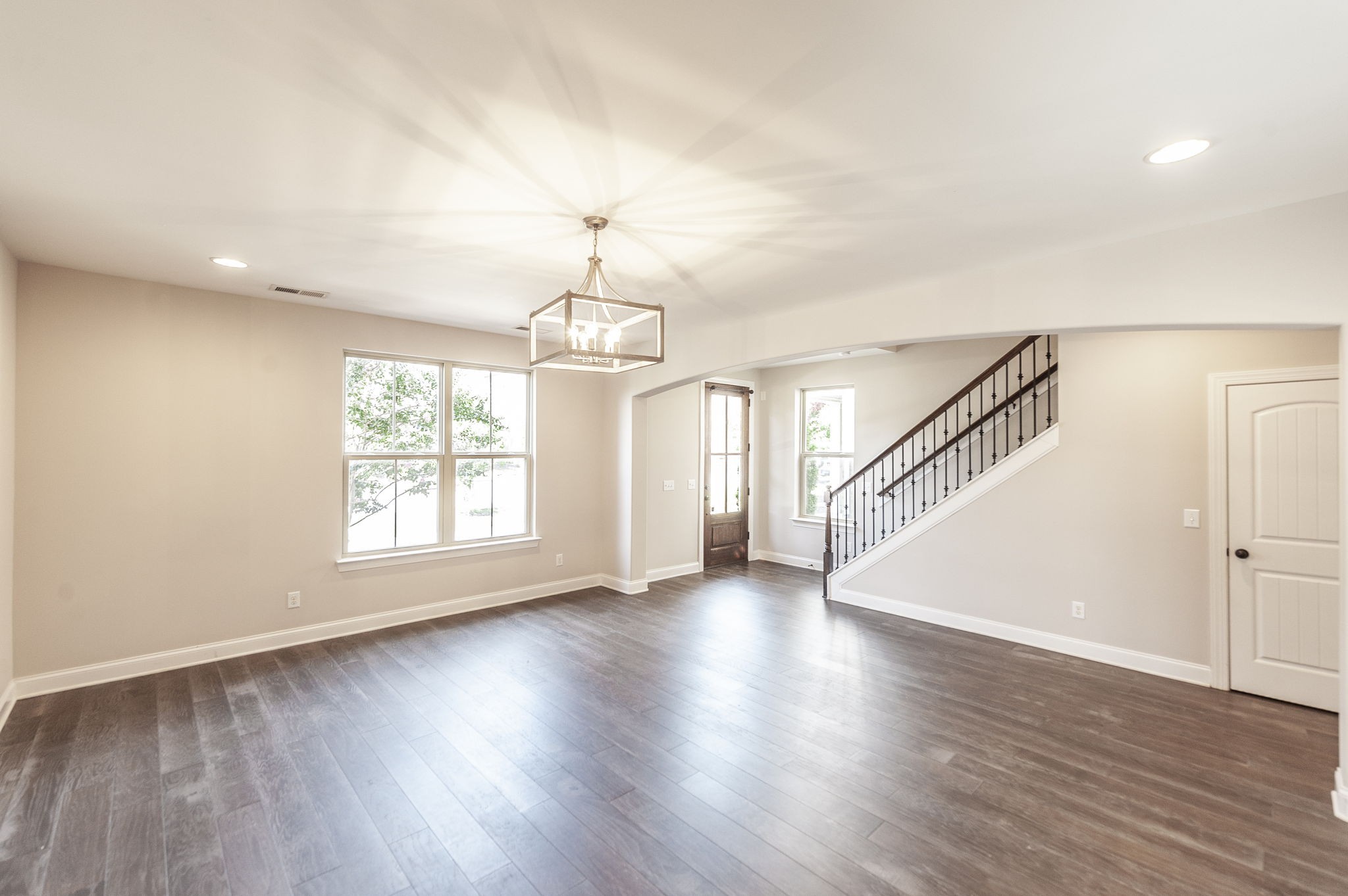 152 Ashcrest Point Hendersonville, TN 37075 - Photo 6 of 63 a view of an empty room with wooden floor and a window