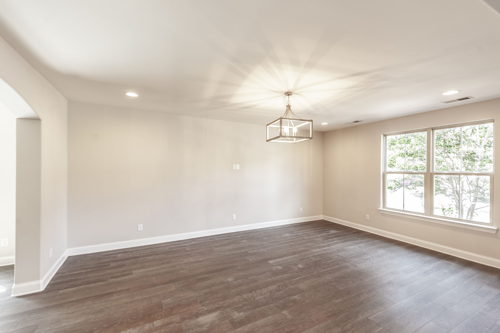152 Ashcrest Point Hendersonville, TN 37075 - Photo 7 of 63 an empty room with wooden floor and window