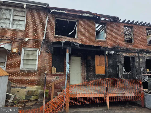 a kitchen with a stove and a refrigerator