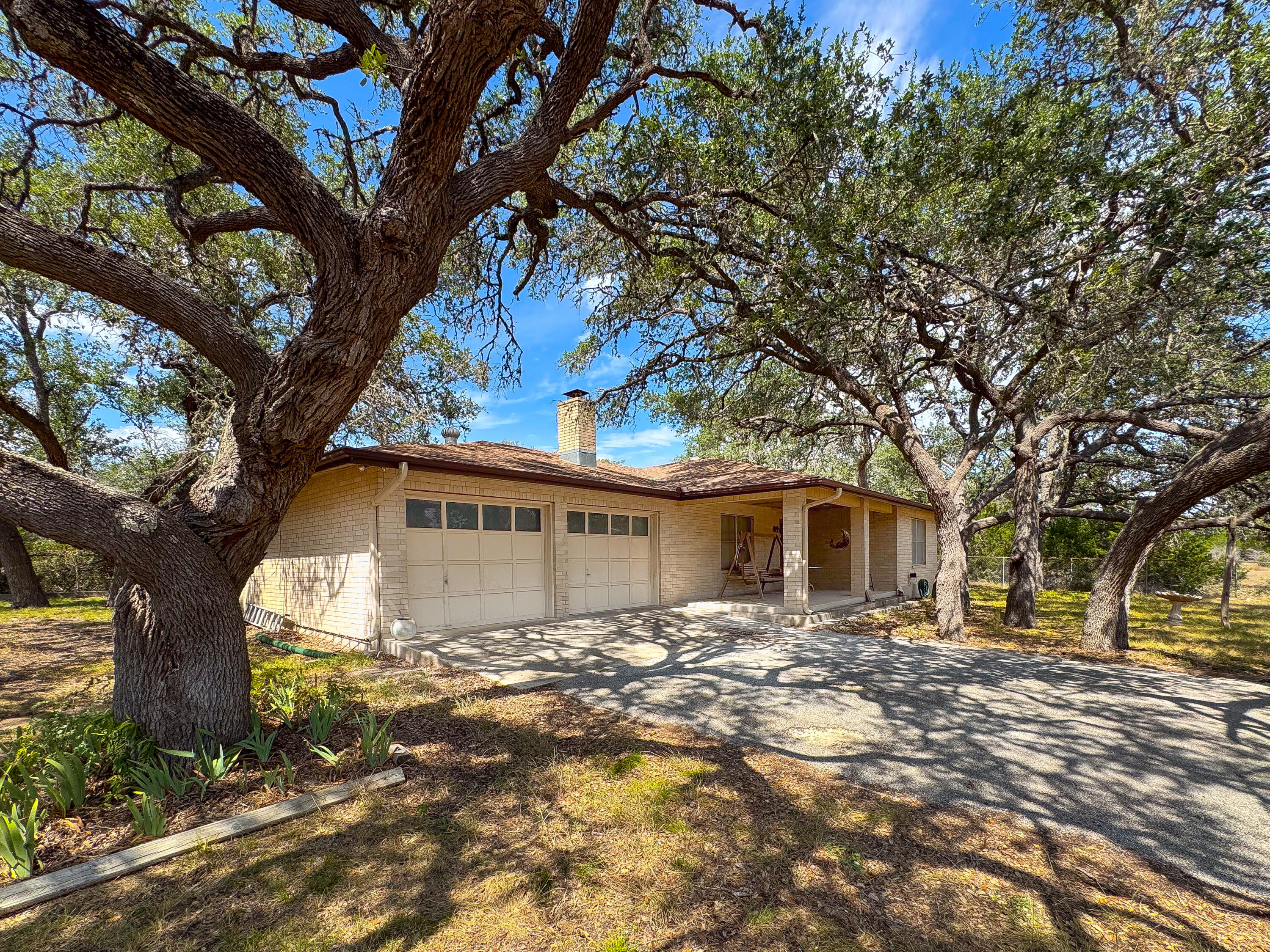 2775 Rust Spring Branch, TX 78070 - Photo 4 of 41 a front view of a house with a yard