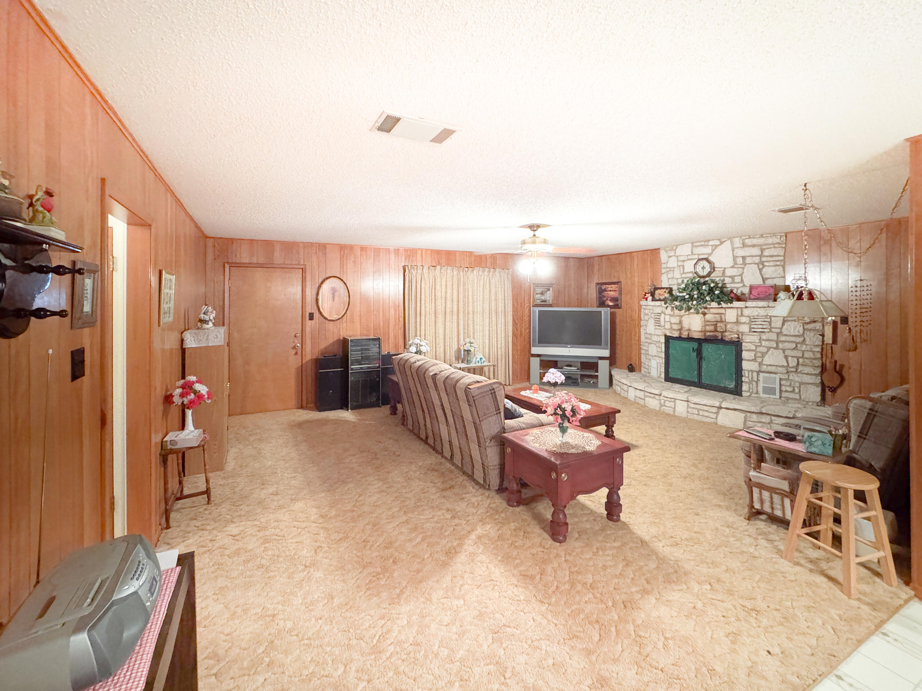 2775 Rust Spring Branch, TX 78070 - Photo 9 of 41 a living room with furniture and a fireplace