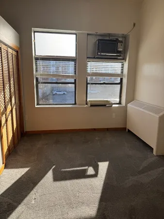 a view of a livingroom with furniture and window