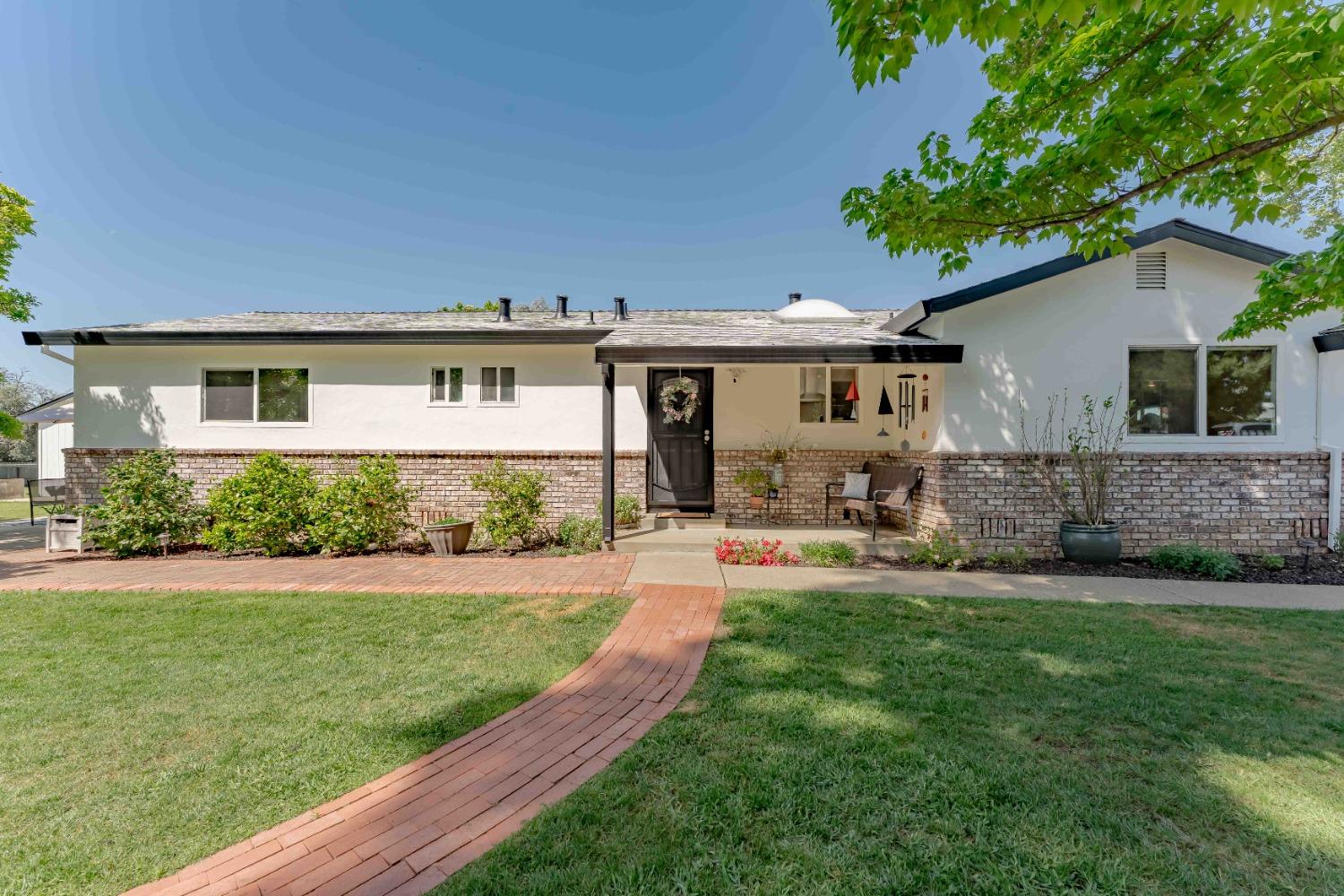 6711 Wyatt Lane Orangevale, CA 95662 - Photo 1 of 1 a front view of house with yard and green space