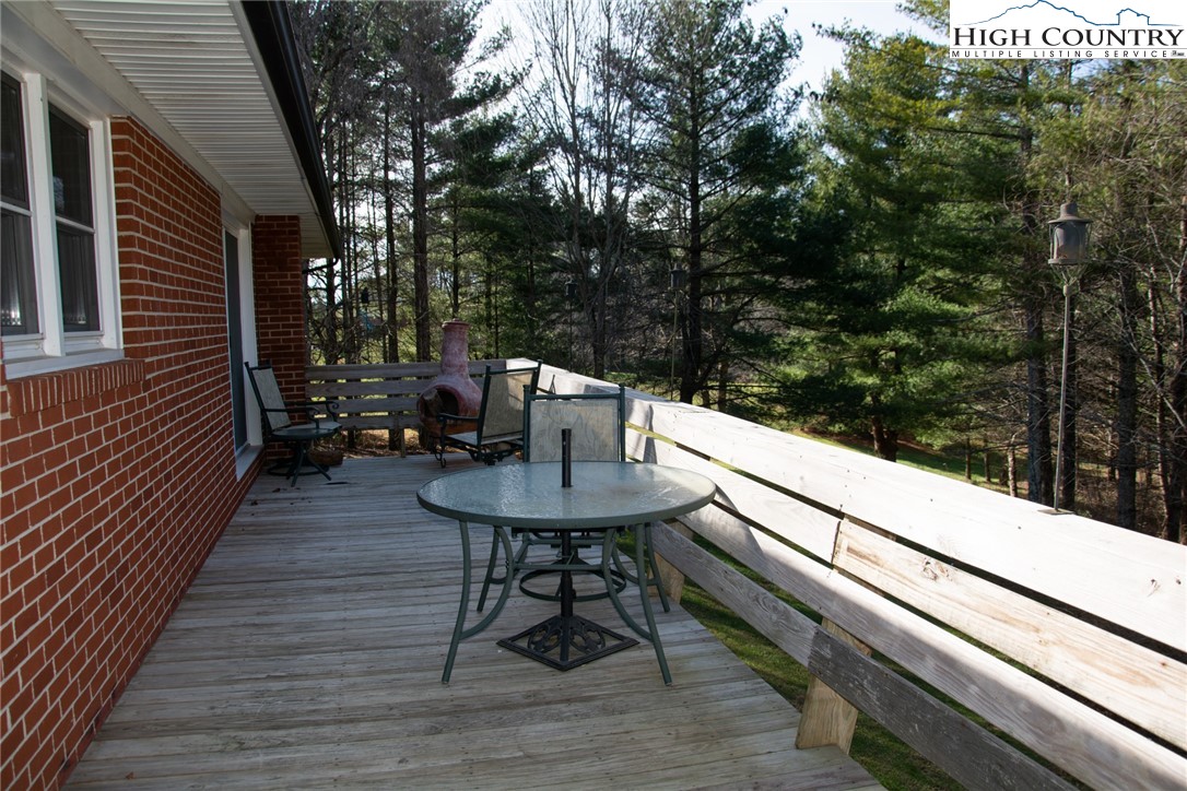 751 Cherry Hill Road Jefferson, NC 28640 - Photo 18 of 24 a view of a balcony with chairs