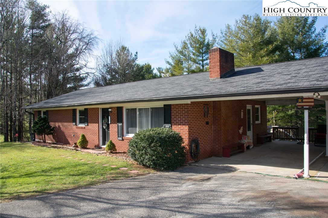 751 Cherry Hill Road Jefferson, NC 28640 - Photo 3 of 24 a front view of a house with garden