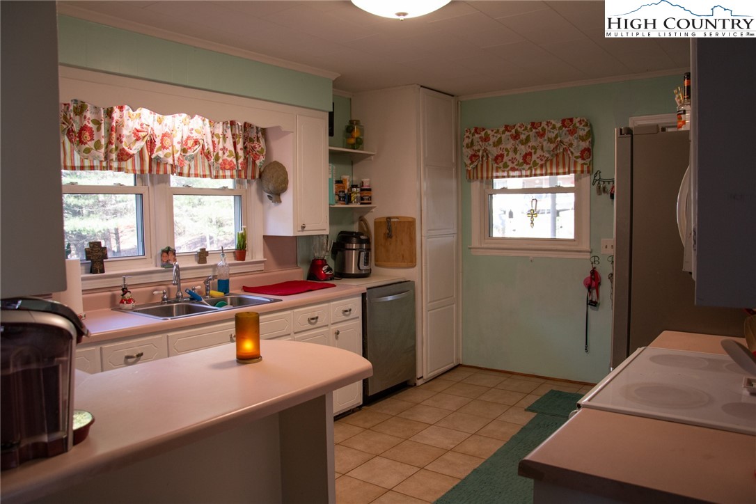 751 Cherry Hill Road Jefferson, NC 28640 - Photo 9 of 24 a room with sink equipment and a window