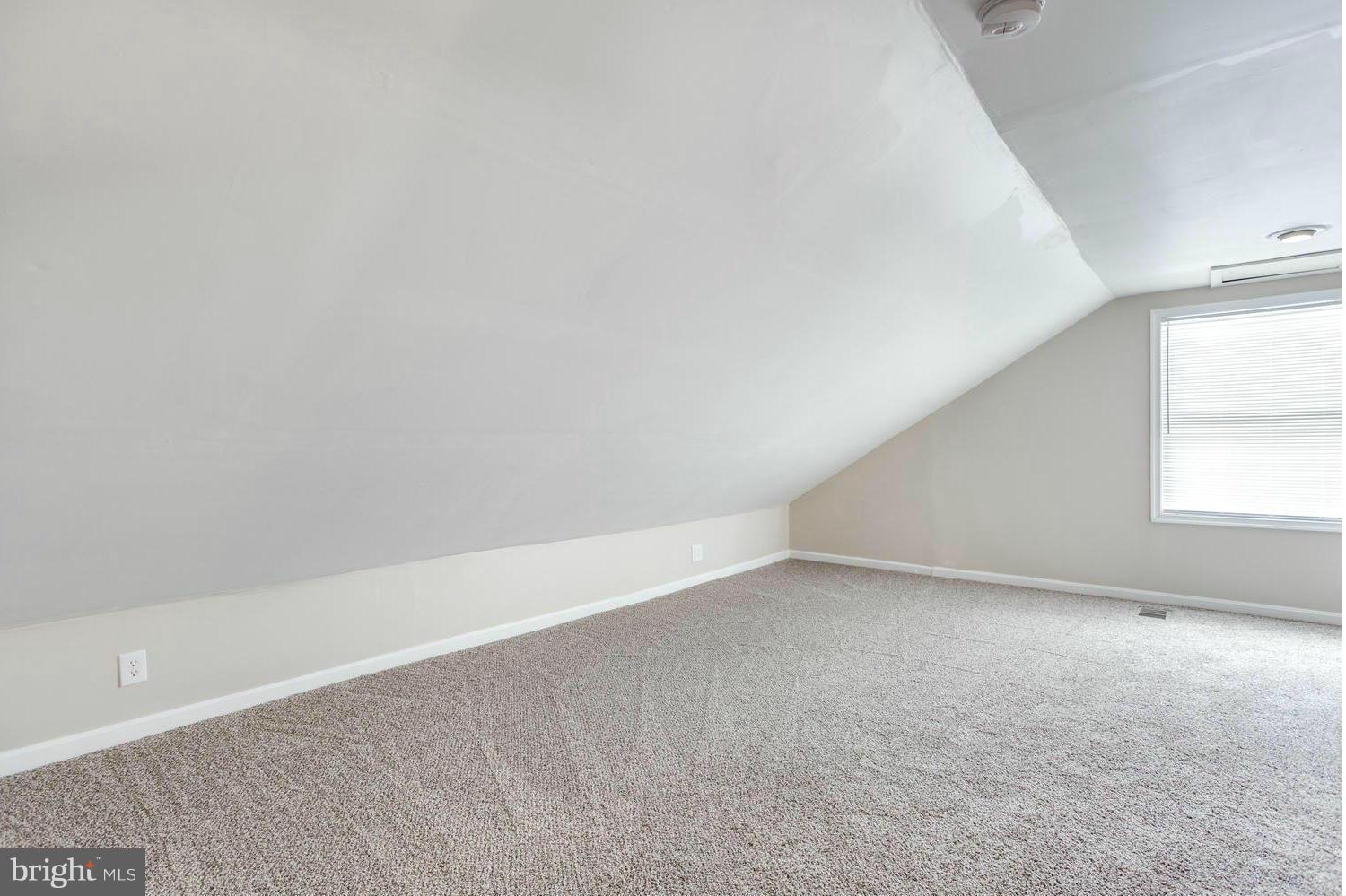 1701 Burnwood Road Baltimore, MD 21239 - Photo 21 of 30 a view of an empty room with a window