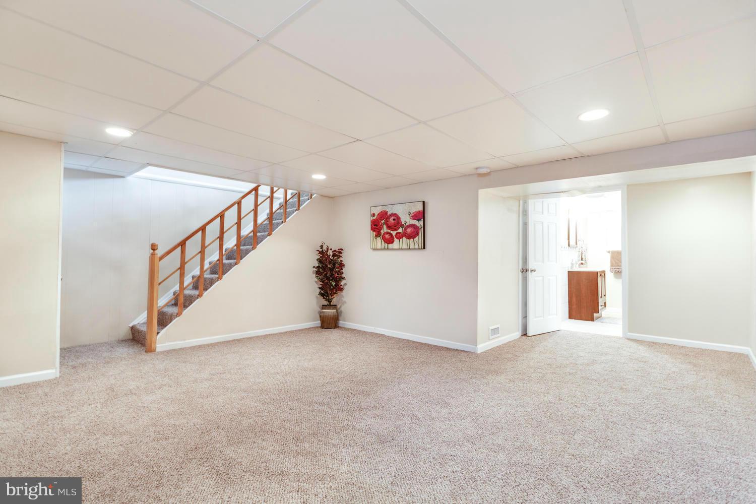 1701 Burnwood Road Baltimore, MD 21239 - Photo 22 of 30 a view of an empty room with wooden floor