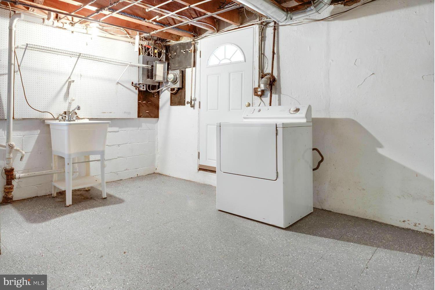 1701 Burnwood Road Baltimore, MD 21239 - Photo 25 of 30 a utility room with dryer and washer
