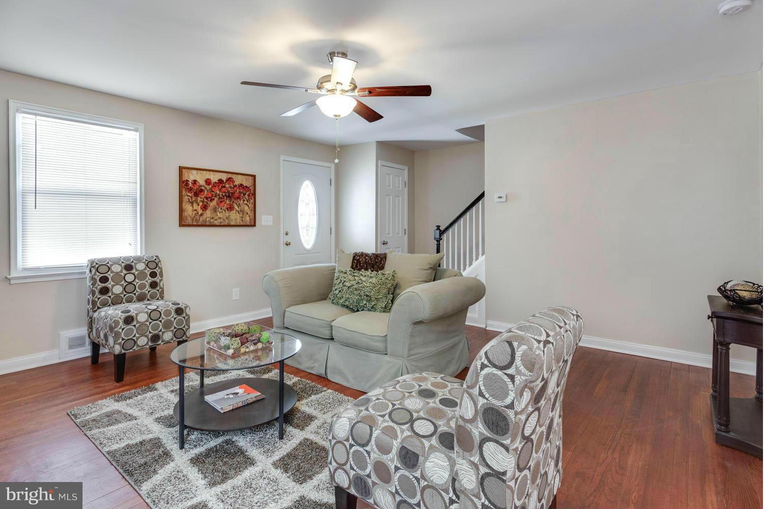 1701 Burnwood Road Baltimore, MD 21239 - Photo 5 of 30 a living room with furniture and wooden floor