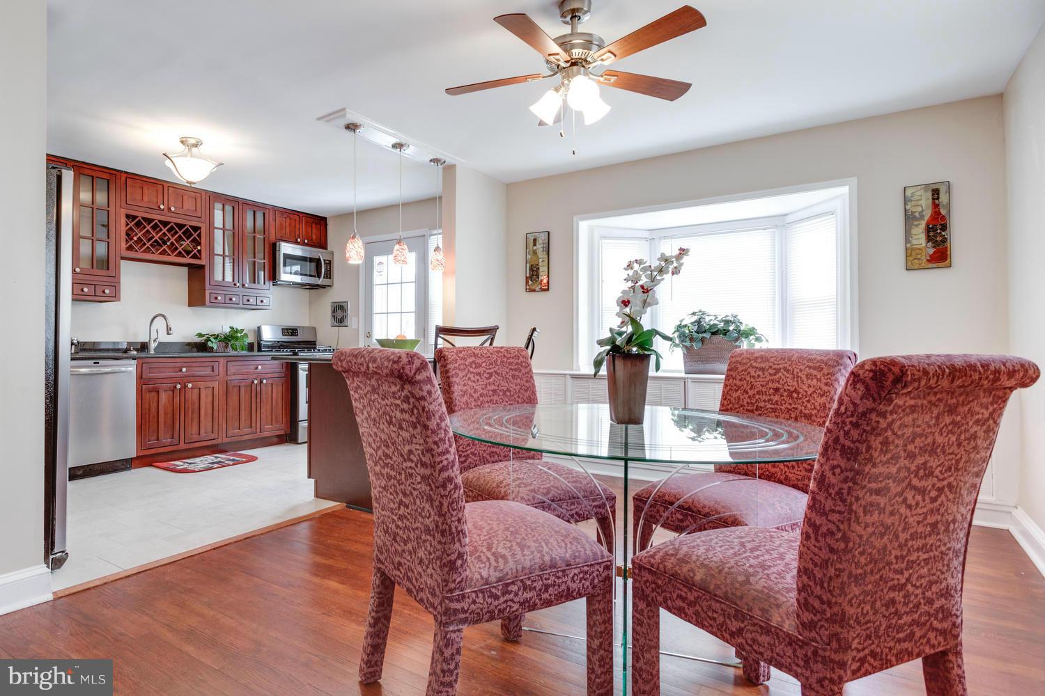 1701 Burnwood Road Baltimore, MD 21239 - Photo 6 of 30 a view of a dining room with furniture window and wooden floor