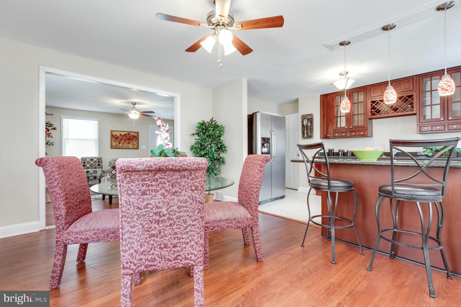 1701 Burnwood Road Baltimore, MD 21239 - Photo 7 of 30 a living room with furniture and a wooden floor
