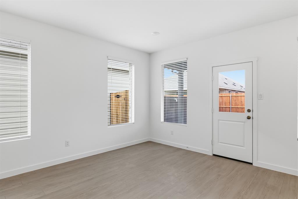 4916 Ascot Way Princeton, TX 75407 - Photo 13 of 39 an empty room with windows