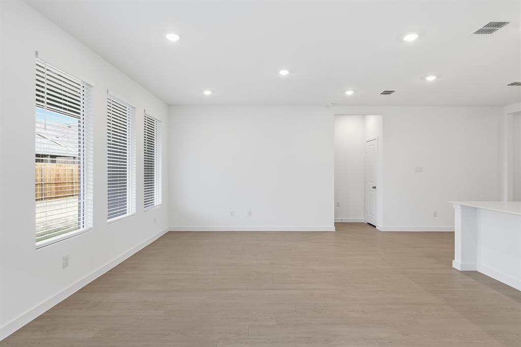 4916 Ascot Way Princeton, TX 75407 - Photo 15 of 39 an empty room with windows