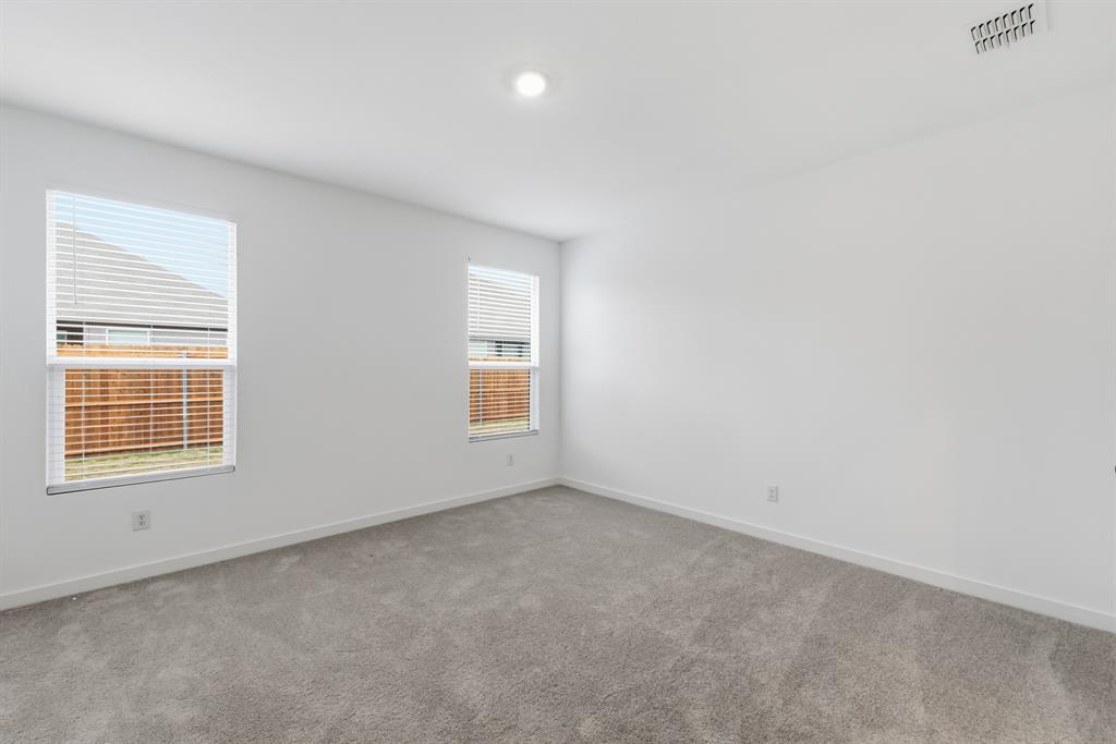 4916 Ascot Way Princeton, TX 75407 - Photo 18 of 39 an empty room with a window