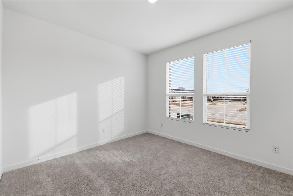 4916 Ascot Way Princeton, TX 75407 - Photo 25 of 39 an empty room with a window