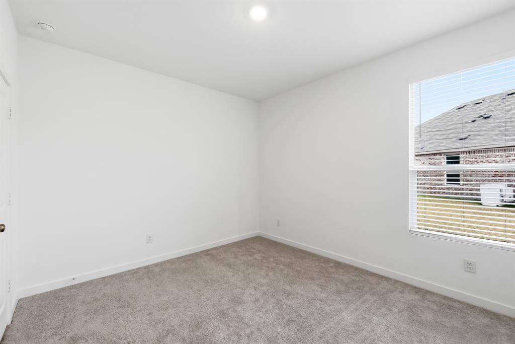4916 Ascot Way Princeton, TX 75407 - Photo 27 of 39 an empty room with a window
