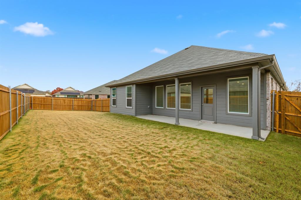 4916 Ascot Way Princeton, TX 75407 - Photo 31 of 39 a house view with swimming pool and brick wall