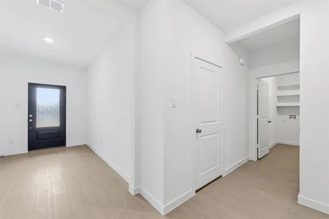 a view of an empty room and closet