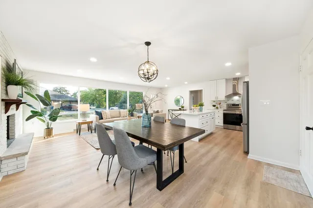 a dining room with furniture and window