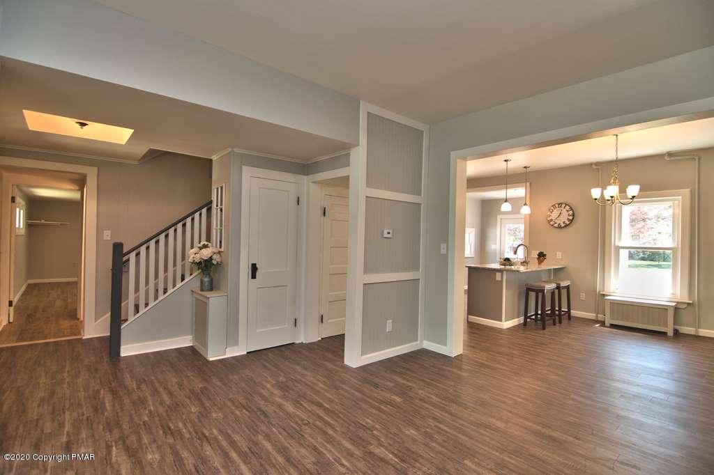 362 Upper Swiftwater Road Cresco, PA 18326 - Photo 12 of 87 a view of a hallway with wooden floor and a dining room