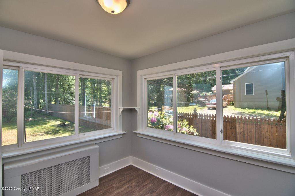 362 Upper Swiftwater Road Cresco, PA 18326 - Photo 25 of 87 a view of a room with a large window and wooden floor
