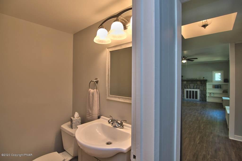 362 Upper Swiftwater Road Cresco, PA 18326 - Photo 28 of 87 a bathroom with a sink and a mirror