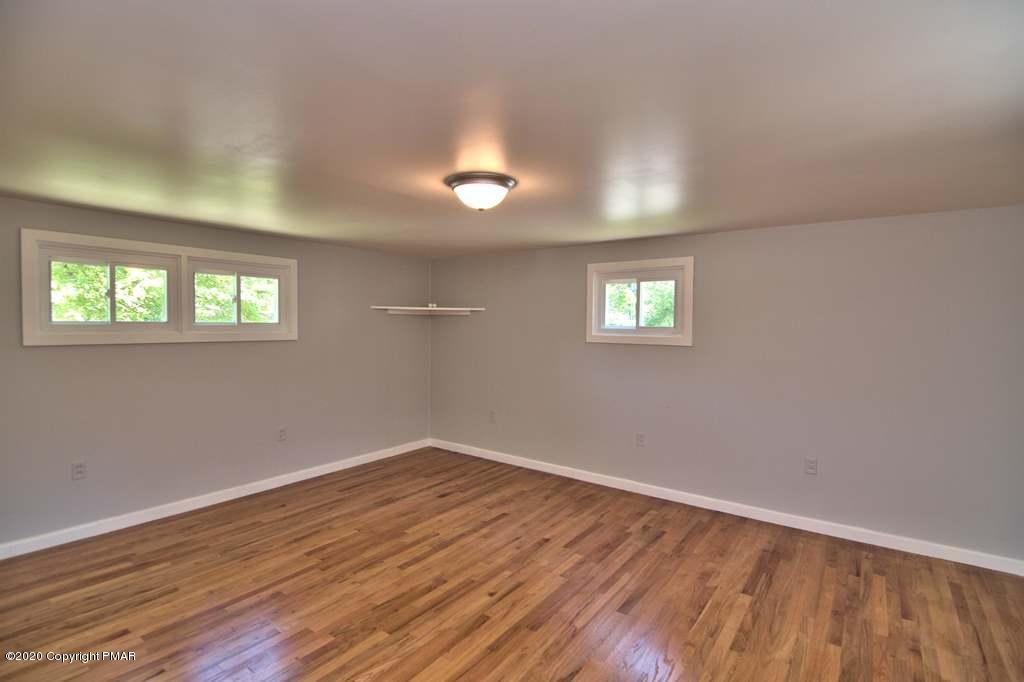 362 Upper Swiftwater Road Cresco, PA 18326 - Photo 32 of 87 an empty room with wooden floor and windows