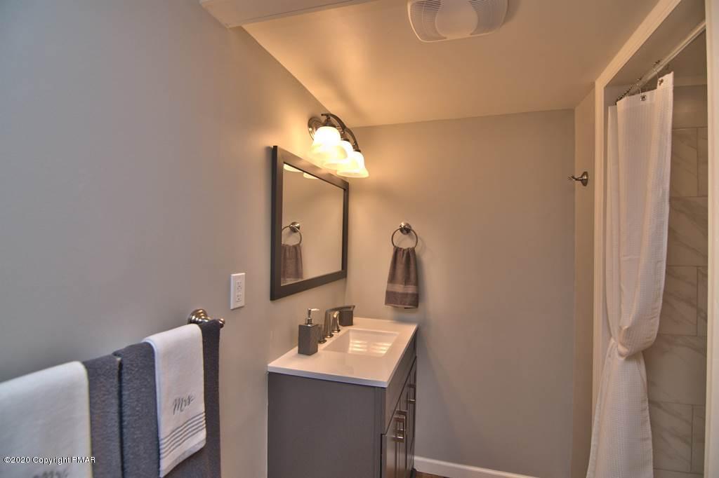 362 Upper Swiftwater Road Cresco, PA 18326 - Photo 34 of 87 a bathroom with a double vanity sink mirror and