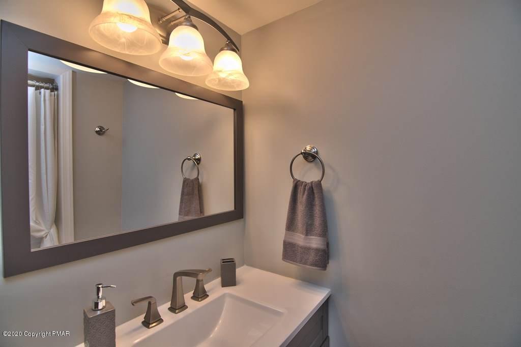 362 Upper Swiftwater Road Cresco, PA 18326 - Photo 37 of 87 a bathroom with a sink and a mirror