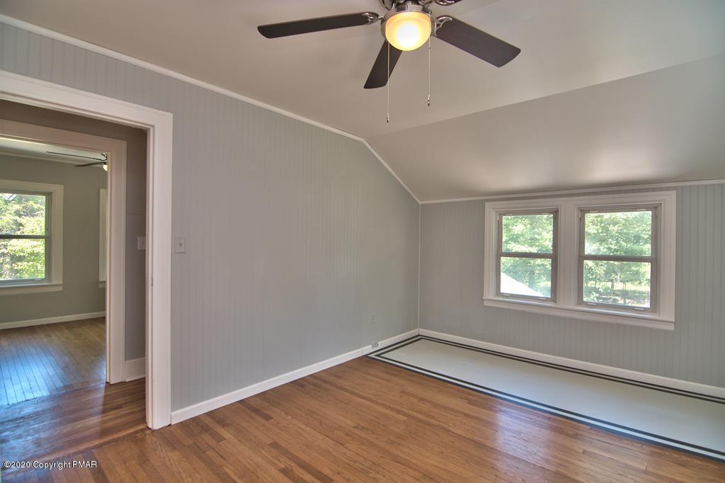 362 Upper Swiftwater Road Cresco, PA 18326 - Photo 40 of 87 an empty room with wooden floor and windows
