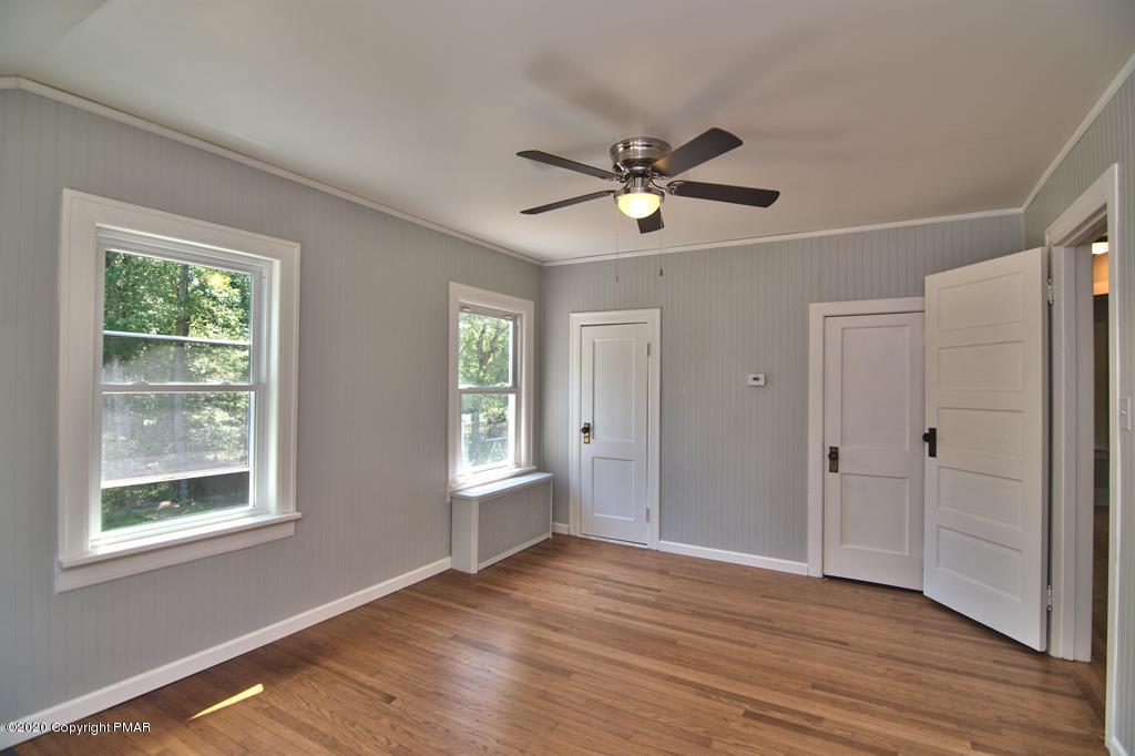 362 Upper Swiftwater Road Cresco, PA 18326 - Photo 41 of 87 a view of empty room with wooden floor and fan