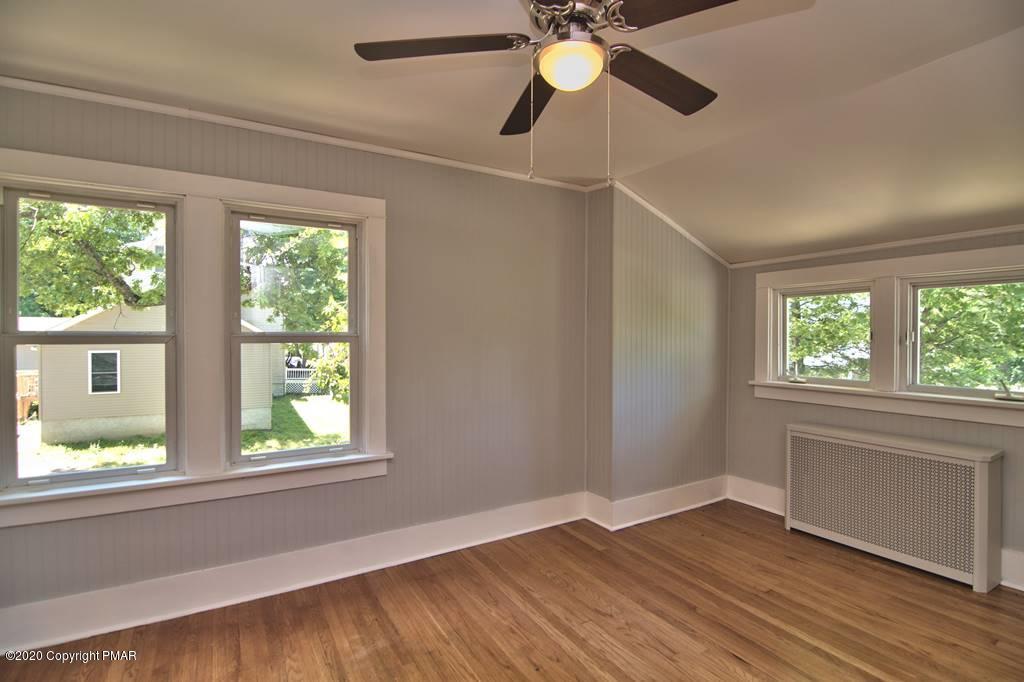 362 Upper Swiftwater Road Cresco, PA 18326 - Photo 46 of 87 an empty room with wooden floor fan and windows