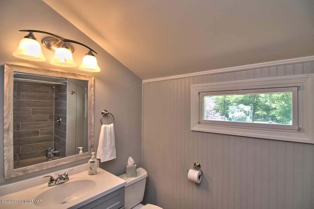 362 Upper Swiftwater Road Cresco, PA 18326 - Photo 49 of 87 a bathroom with a sink and a mirror