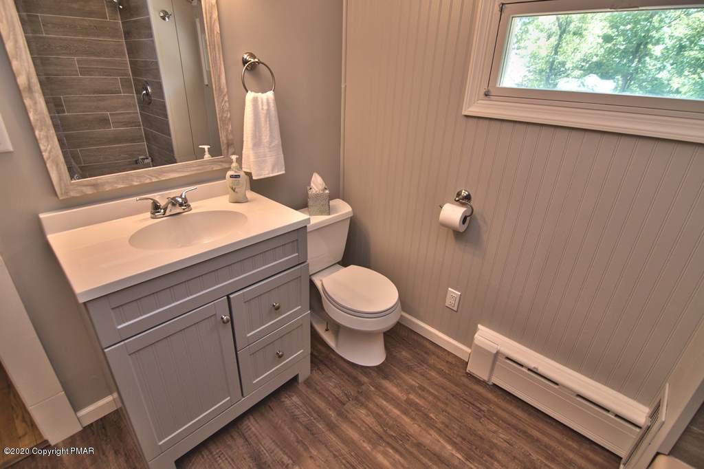 362 Upper Swiftwater Road Cresco, PA 18326 - Photo 50 of 87 a bathroom with a sink a toilet and a window