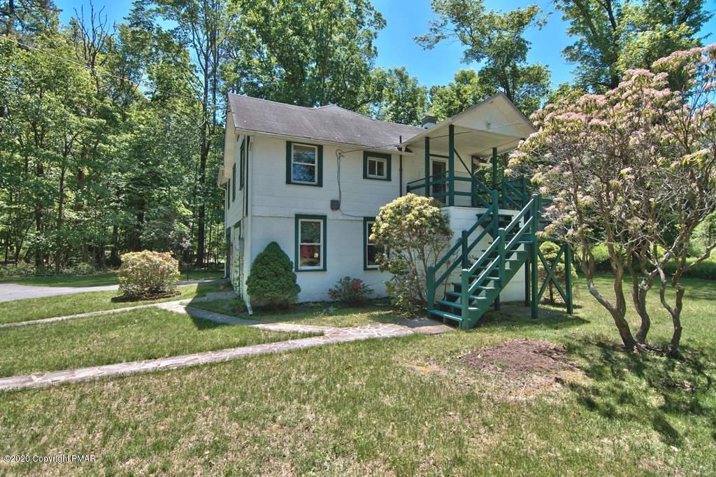 362 Upper Swiftwater Road Cresco, PA 18326 - Photo 64 of 87 a view of a house with a yard and plants