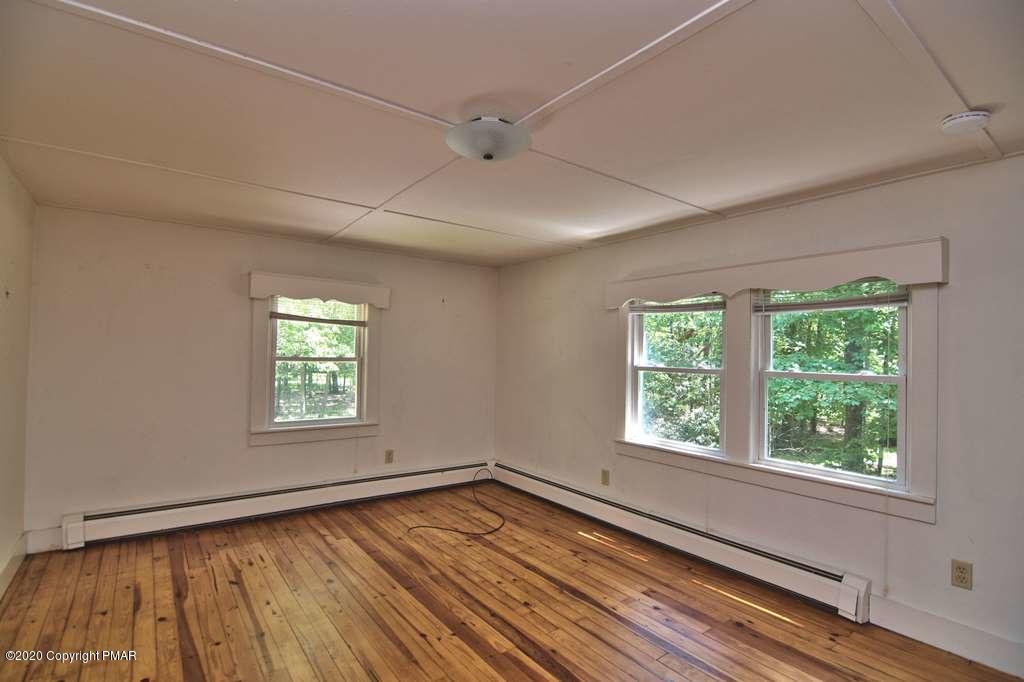 362 Upper Swiftwater Road Cresco, PA 18326 - Photo 73 of 87 a view of an empty room with wooden floor and a window