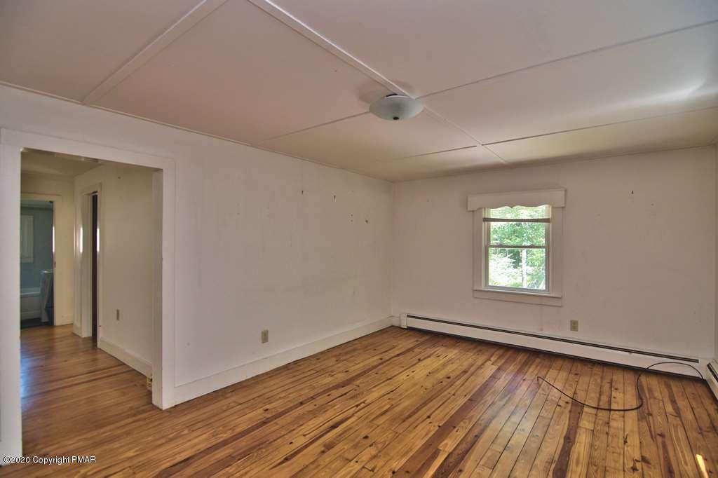 362 Upper Swiftwater Road Cresco, PA 18326 - Photo 74 of 87 a view of an empty room with wooden floor and a window