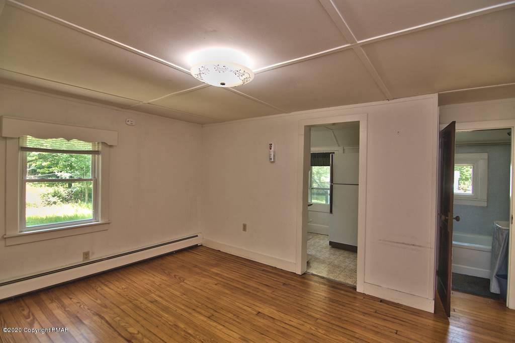 362 Upper Swiftwater Road Cresco, PA 18326 - Photo 75 of 87 an empty room with wooden floor and windows