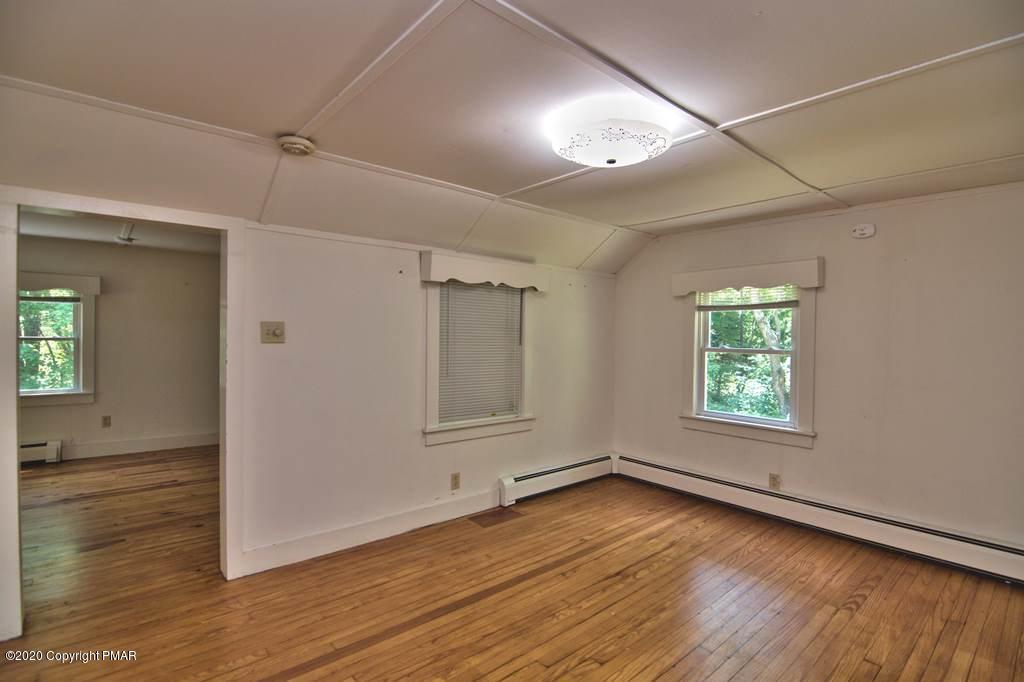 362 Upper Swiftwater Road Cresco, PA 18326 - Photo 76 of 87 an empty room with wooden floor and windows