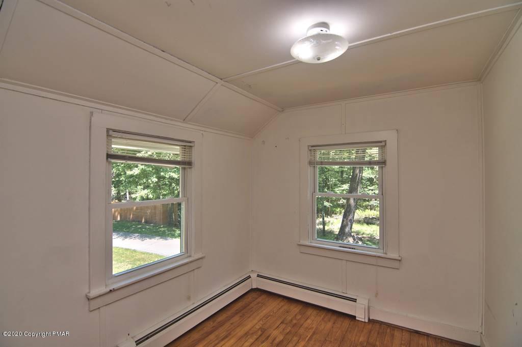 362 Upper Swiftwater Road Cresco, PA 18326 - Photo 80 of 87 an empty room with wooden floor and windows